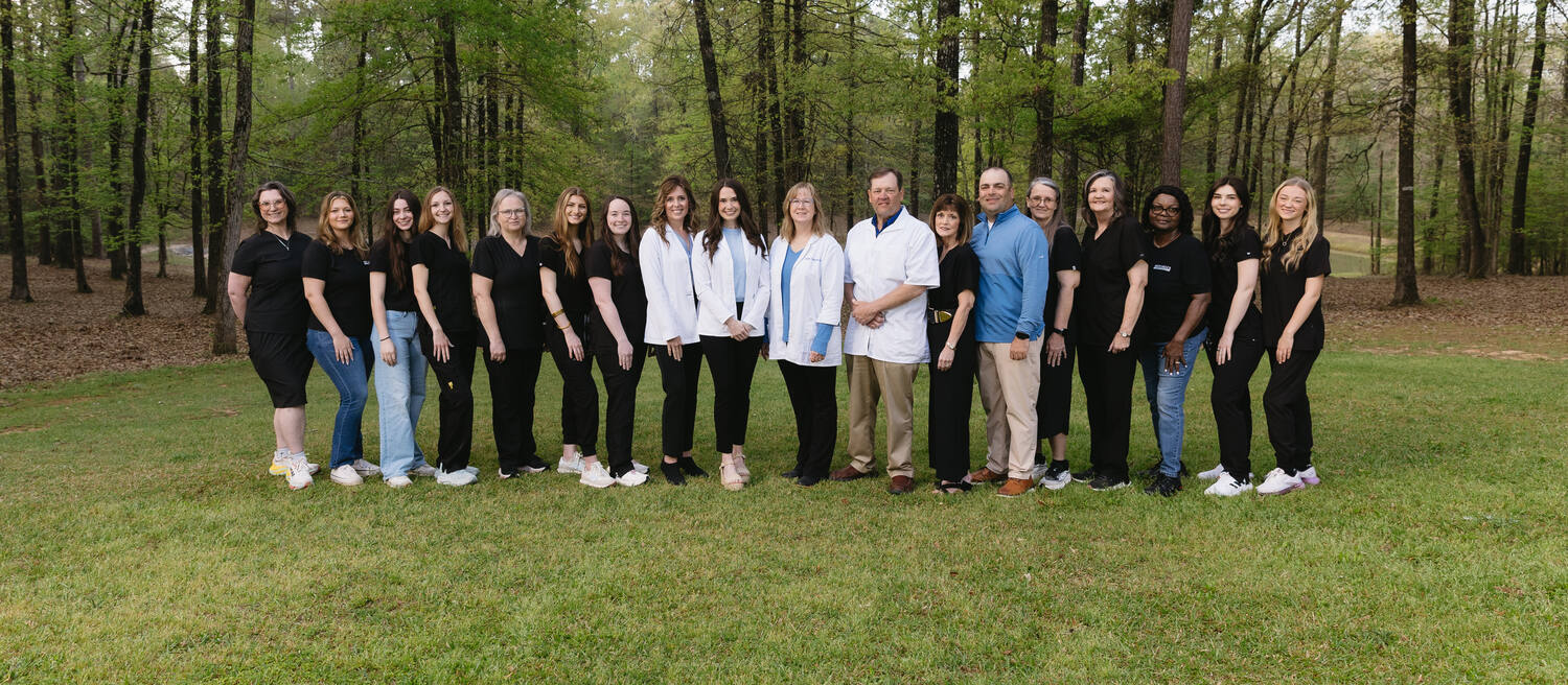 The full Mitchell's Pharmacy team gathered outdoors in Jonesboro, Louisiana